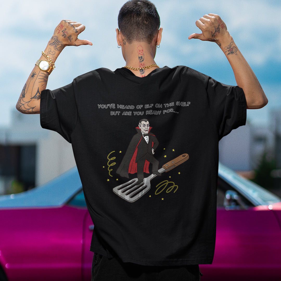 You've heard of elf on the shelf but are you ready for Dracula on a Spatula T-Shirt (backprint)