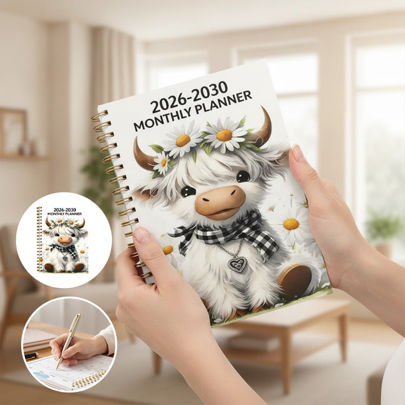 2026-2030 planner held while writing
