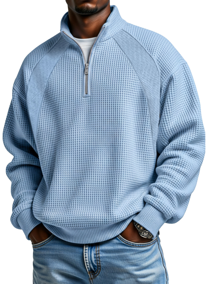 Blue waffle textured men's quarter zip pullover showing the stand collar and fabric detail