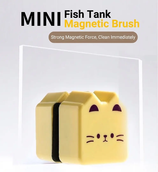 Magnetic fish tank cleaning brush in use on aquarium glass