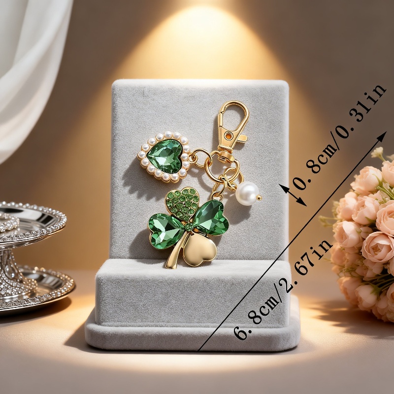Decorative green clover bag charm with gold ring