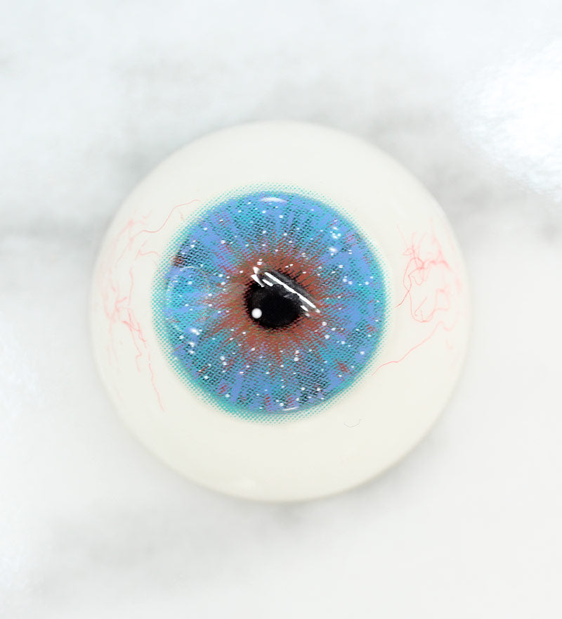 Uris Interstellar blue colored contacts on Light eye