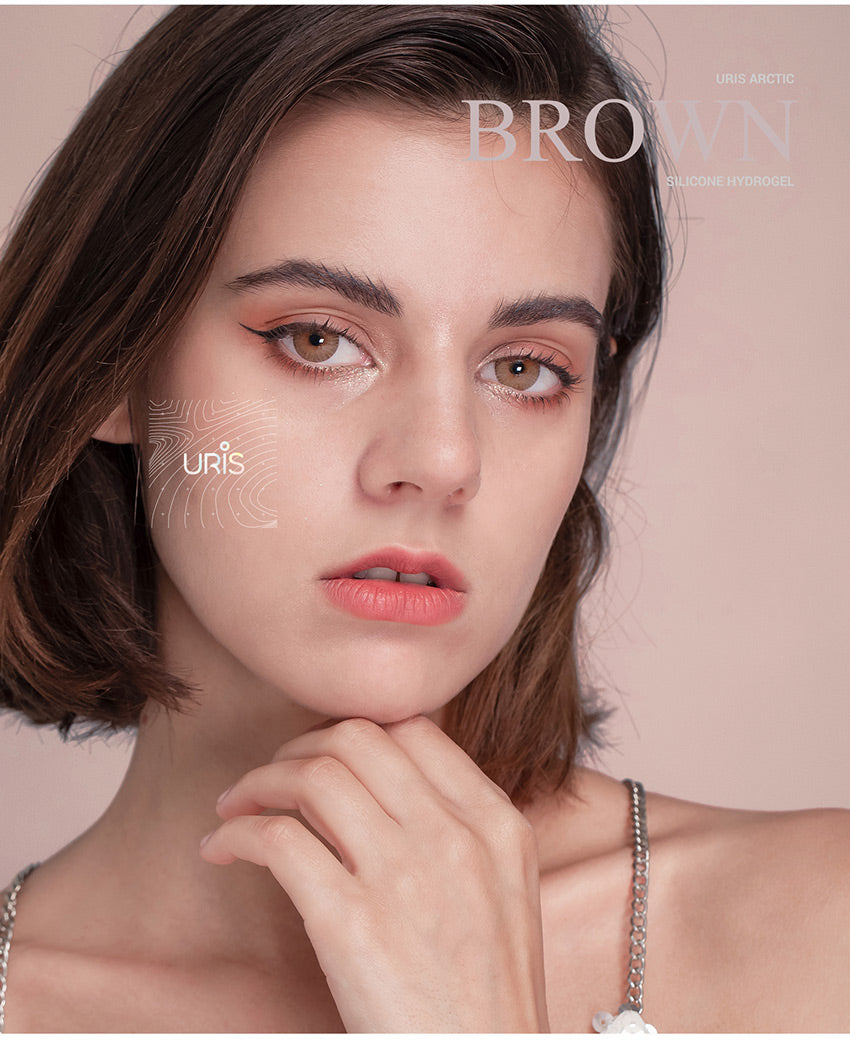 Close up of natural Uris Arctic Brown colored contact lenses on eyes