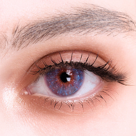 Uris Interstellar Violet colored contacts on eye