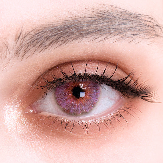 Uris Interstellar pink colored contacts on eye