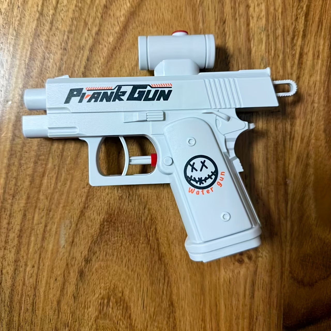 Reverse water gun toy prank