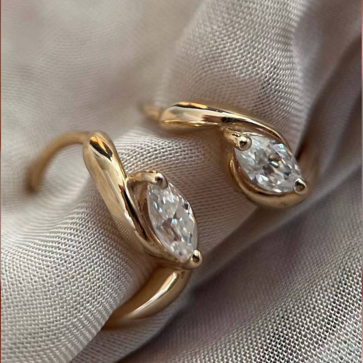 The Marquise Huggie Hoops