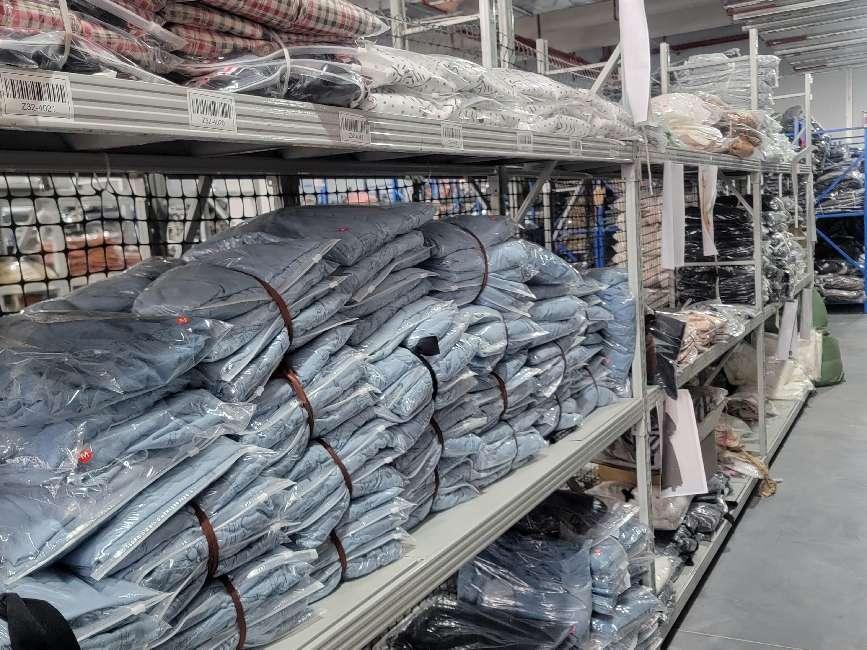 Garment inventory stored on warehouse shelves