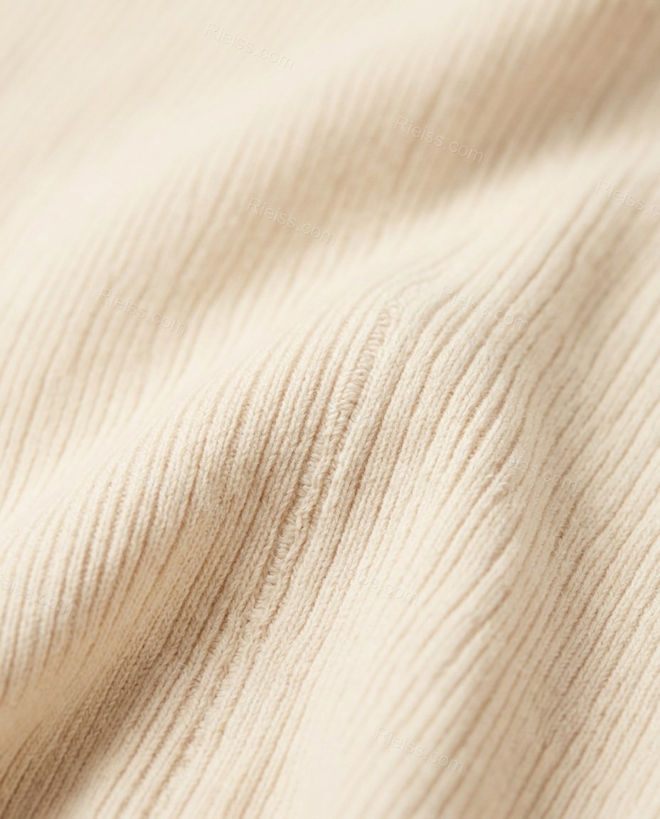 Cream Fringe Knit Ribbed Vest, close-up of fringe trim, single button closure and ribbed texture, by Rieiss