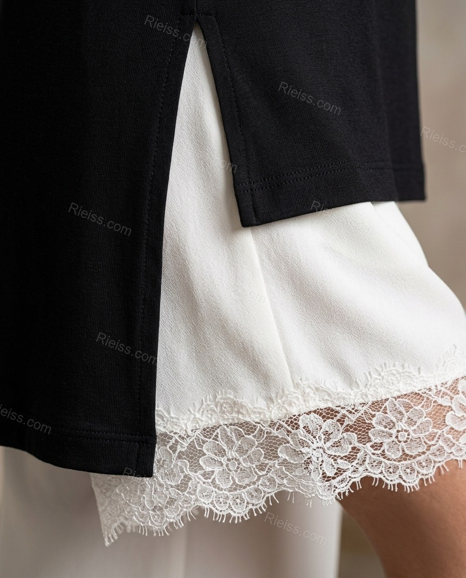 Black High-Low Asymmetric Lace Tunic & Pants Set, close-up of white accents, high-low hem and side slit, by Rieiss