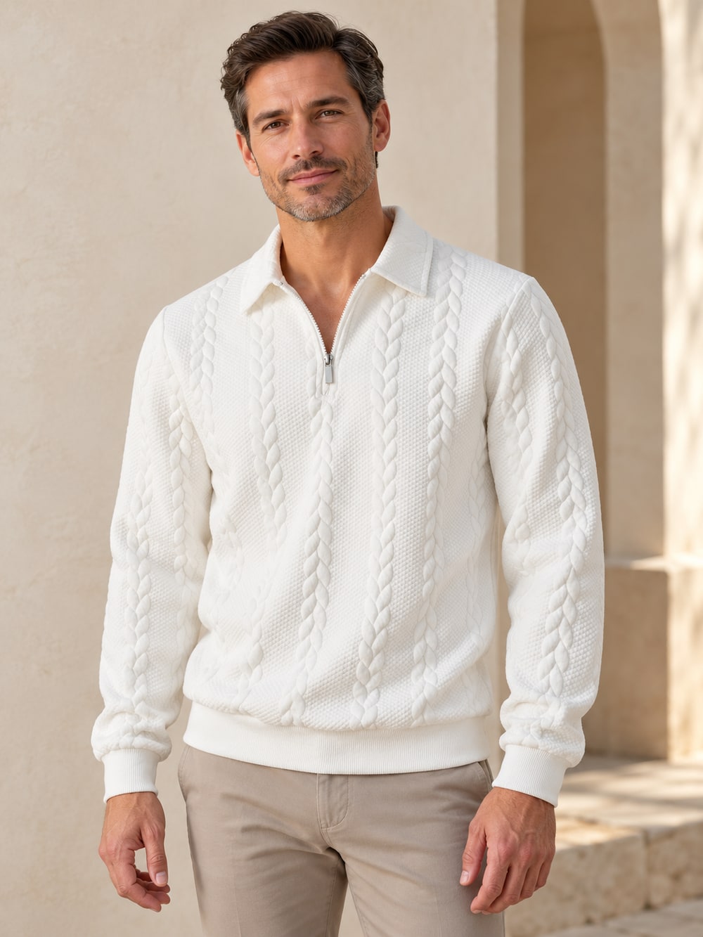 Man wearing the white textured quarter-zip sweater, with collar, cuffs and complete lower hem visible