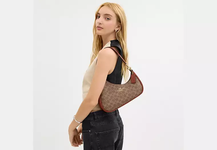 Twisted Teri Shoulder Bag In Signature Canvas
