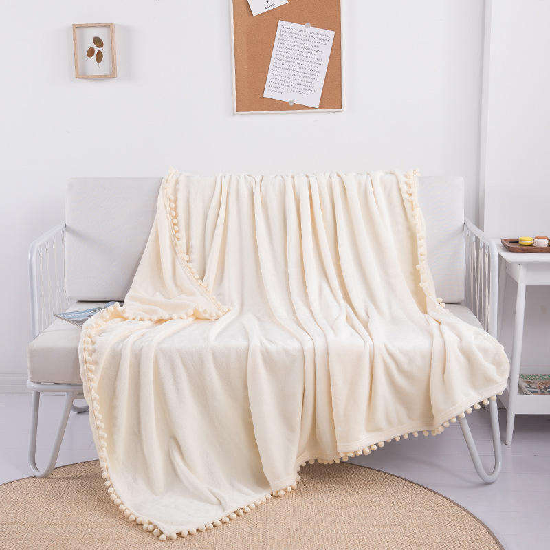 OEM ODM Wholesale Cozy Warm Flannel Blanket With Pom Pom Fringe Skin Friendly for Hotel Homestay Daily Rest Travel