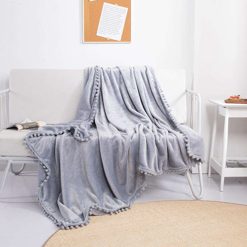 OEM ODM Wholesale Cozy Warm Flannel Blanket With Pom Pom Fringe Skin Friendly for Hotel Homestay Daily Rest Travel