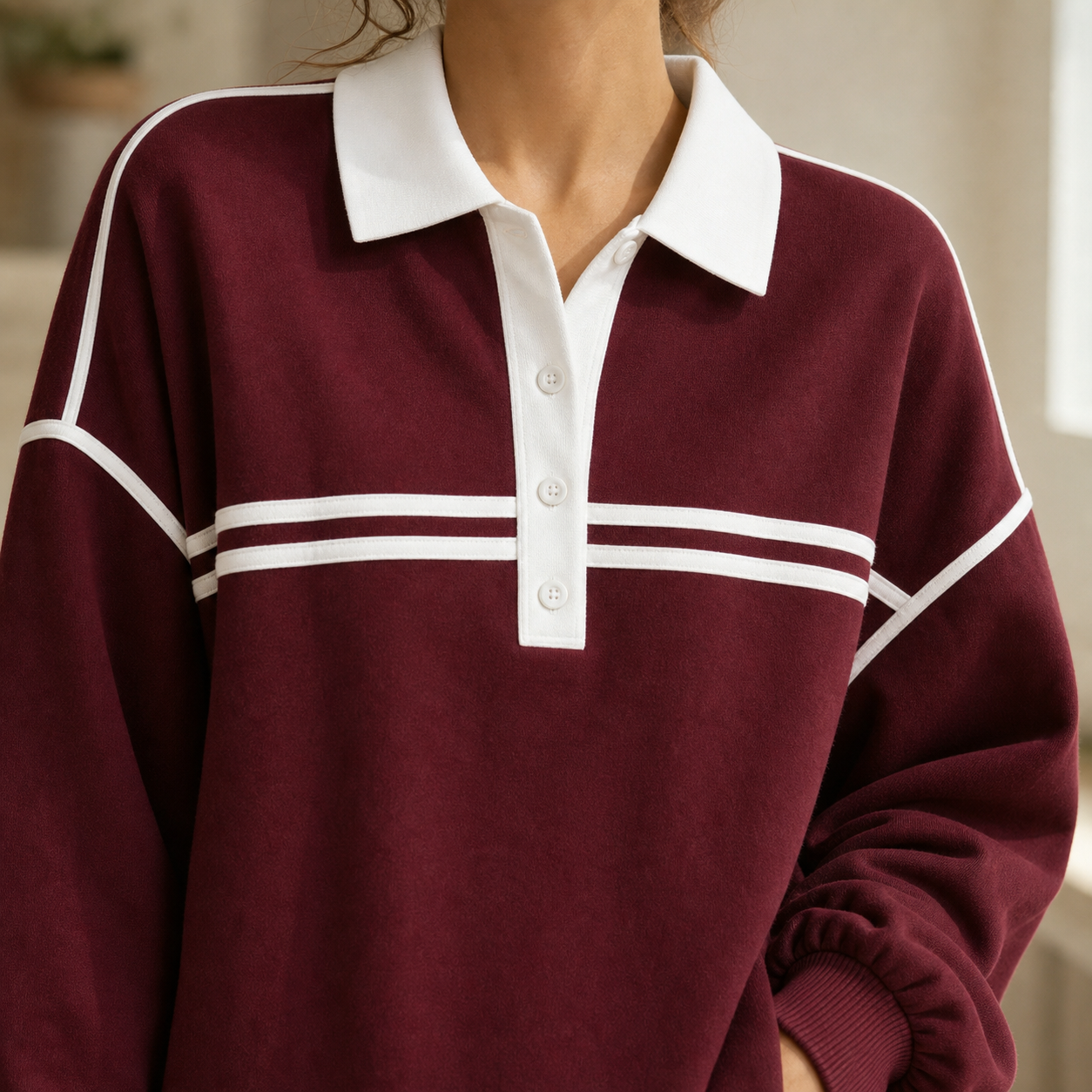 Burgundy set close detail showing white collar, button placket and double chest stripes