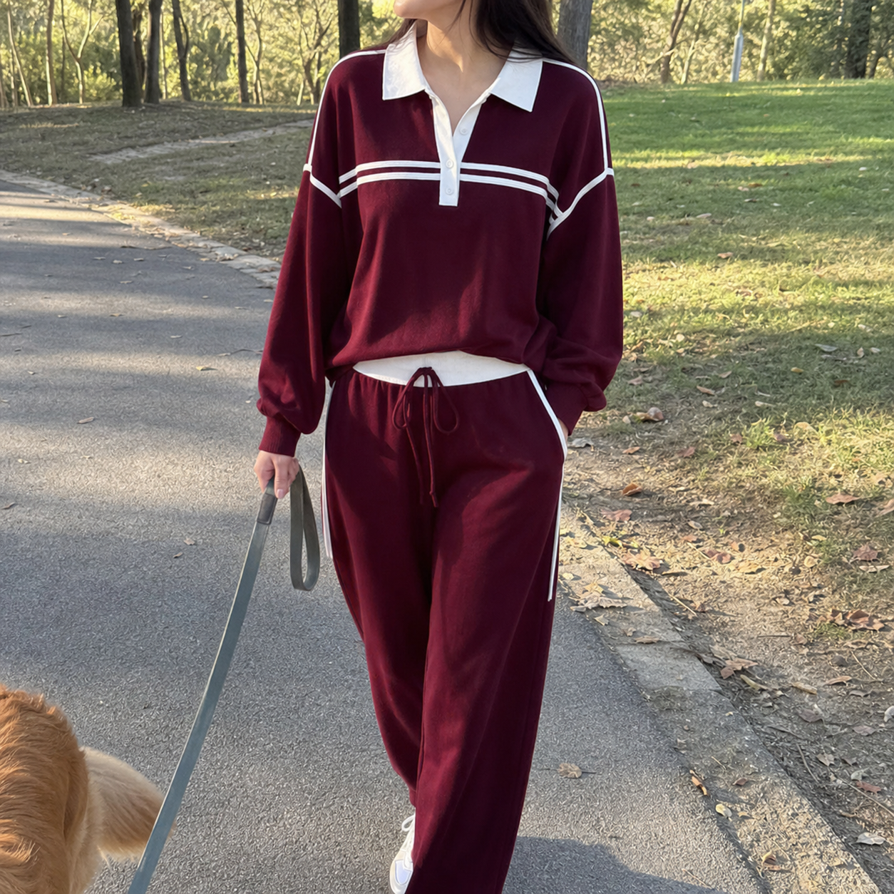 Customer walking outdoors in the Burgundy contrast-trim set