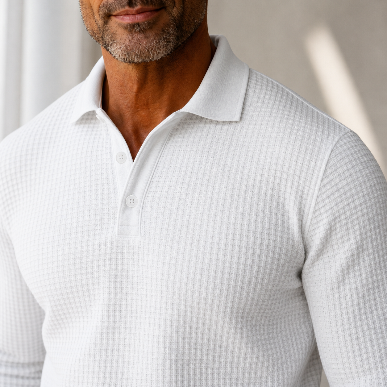Close view of White pure cotton waffle-knit polo collar and button placket