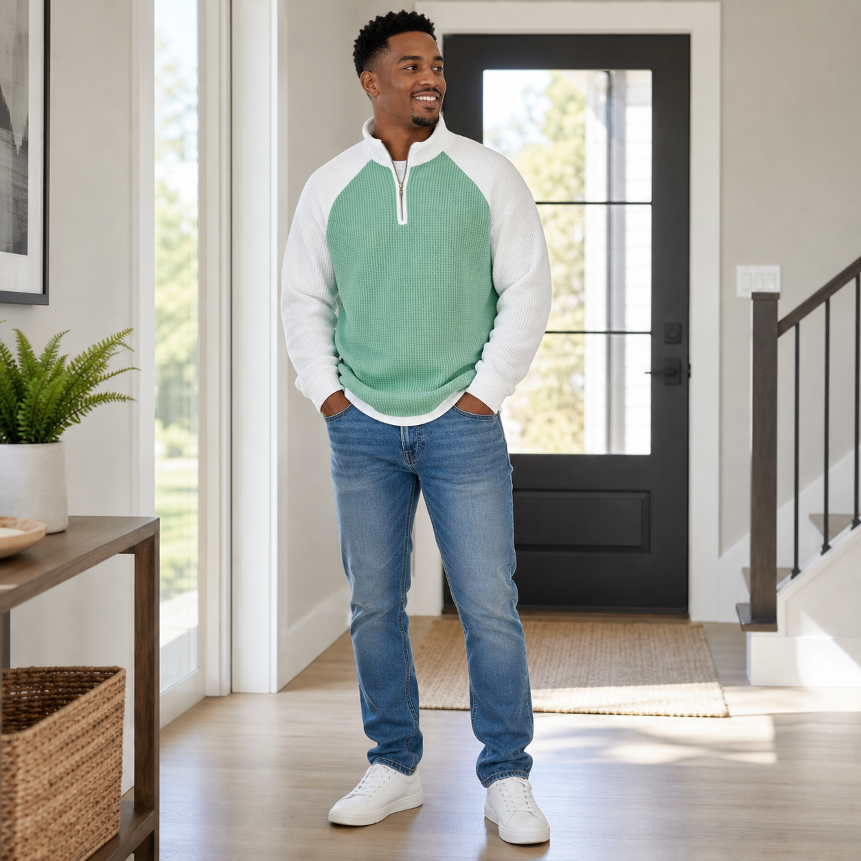 Man wearing the mint green and white color block waffle half-zip pullover