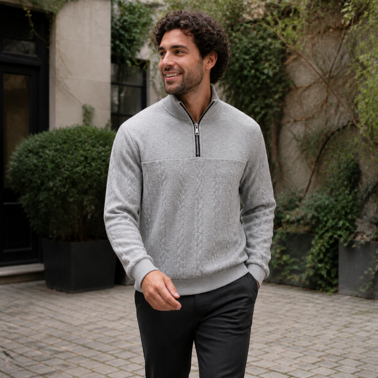 Light grey cable-knit quarter-zip stand-collar sweater styled casually