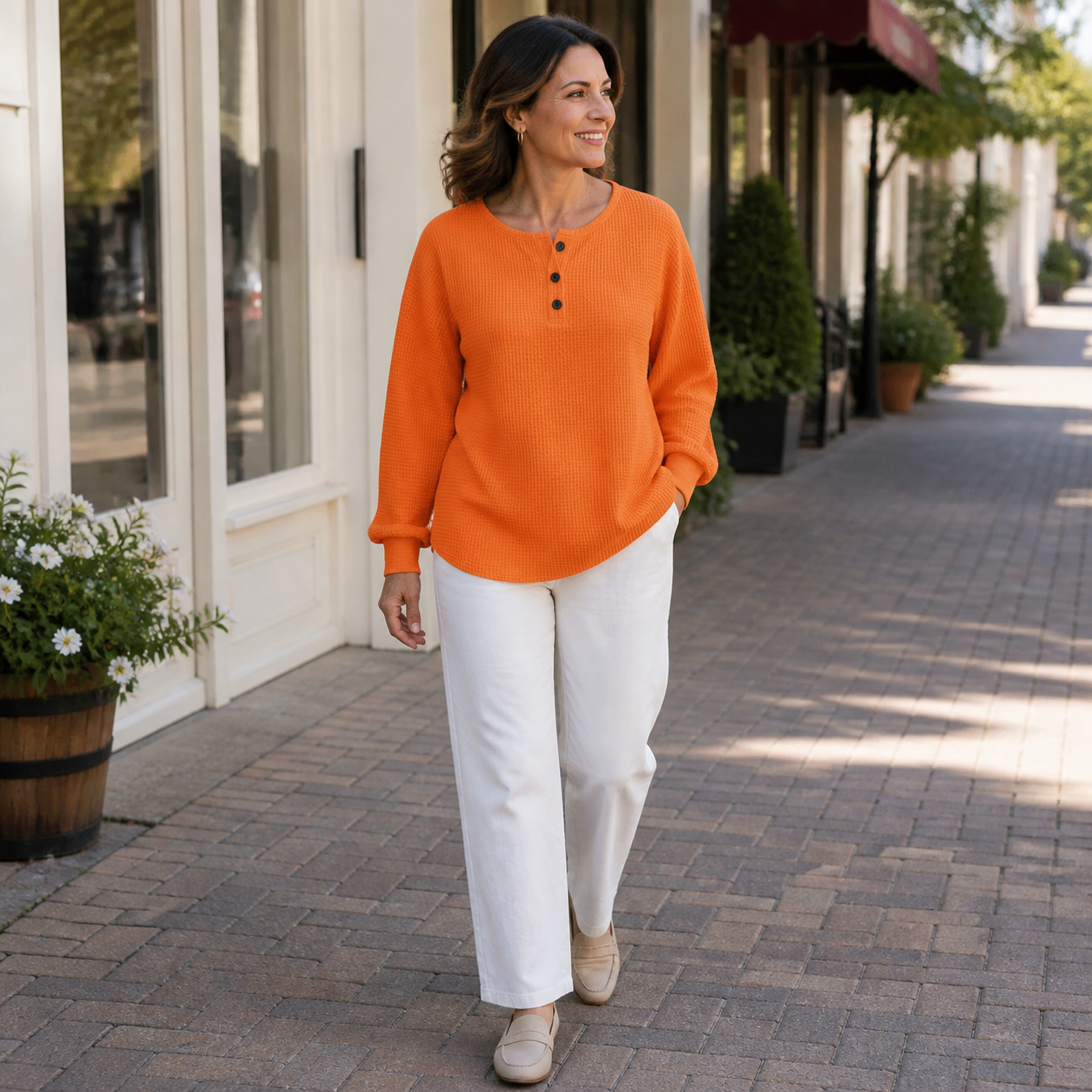 Mature woman wearing the Orange Full Size Waffle Knit Button Detail Top