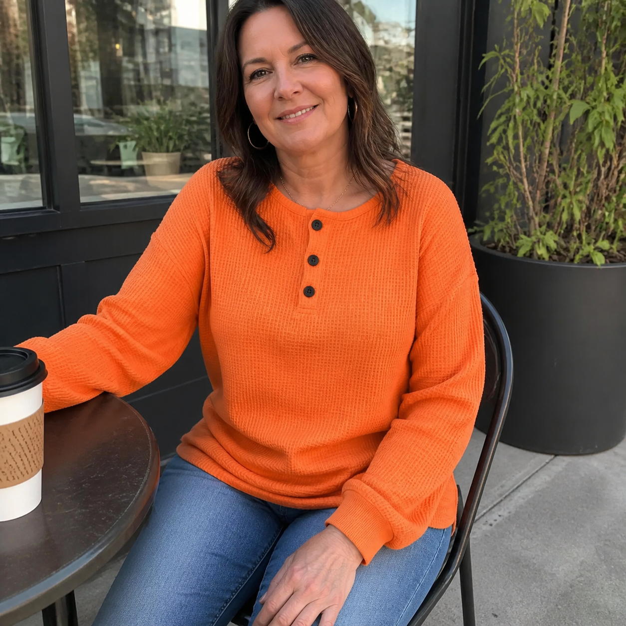 Customer outdoor photo wearing the Orange Waffle Knit Button Detail Top