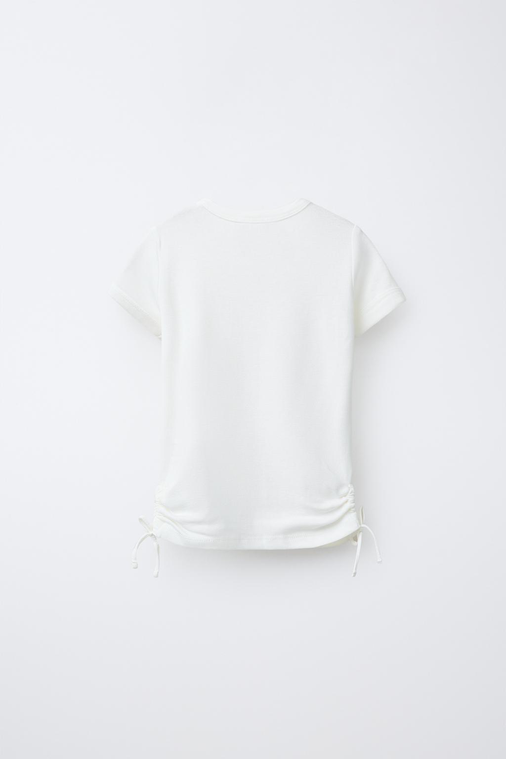 T-SHIRT WITH MODAL CUT-OUT BOWS