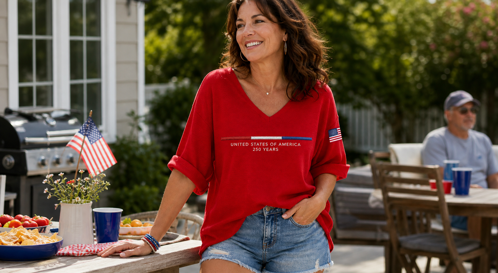 Woman wearing red Americana-inspired waffle top in a casual weekend backyard scene