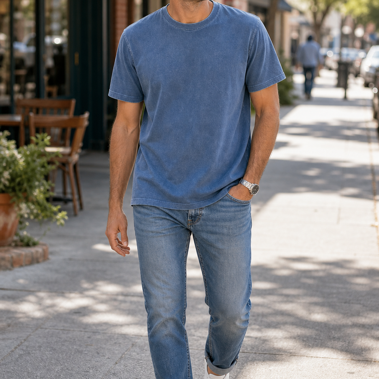 Man wearing garment-dyed crewneck T-shirt in a casual outdoor scene