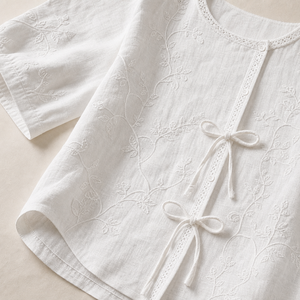 4tu0716003 embroidery fabric neckline buttons tie front and hem details