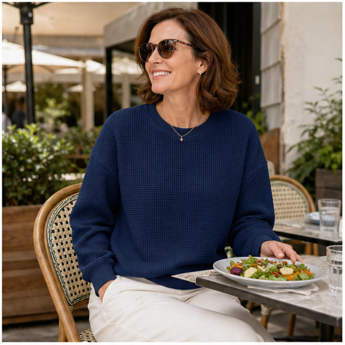 T3u0730002 navy waffle sweatshirt at an outdoor cafe