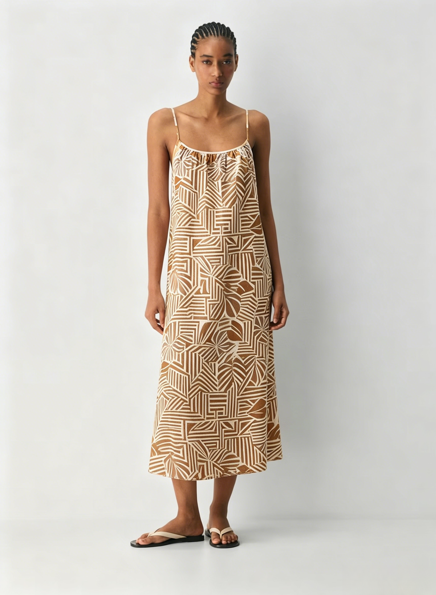 Linen Dress  A long, backless dress with a curved neckline