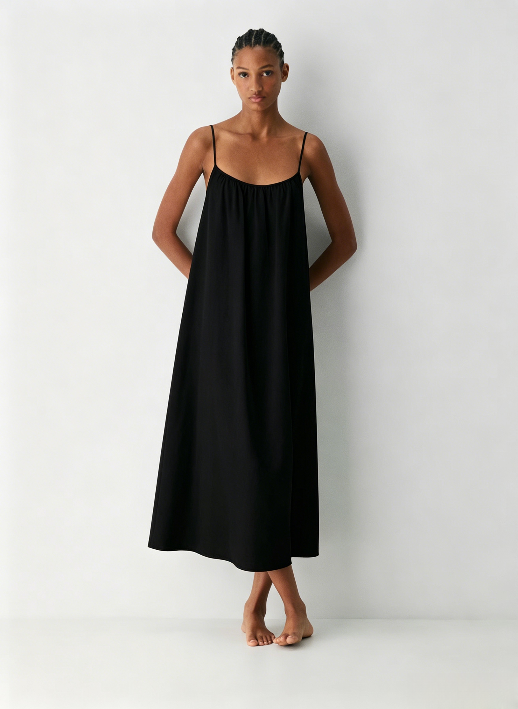 Linen Dress  A long, backless dress with a curved neckline
