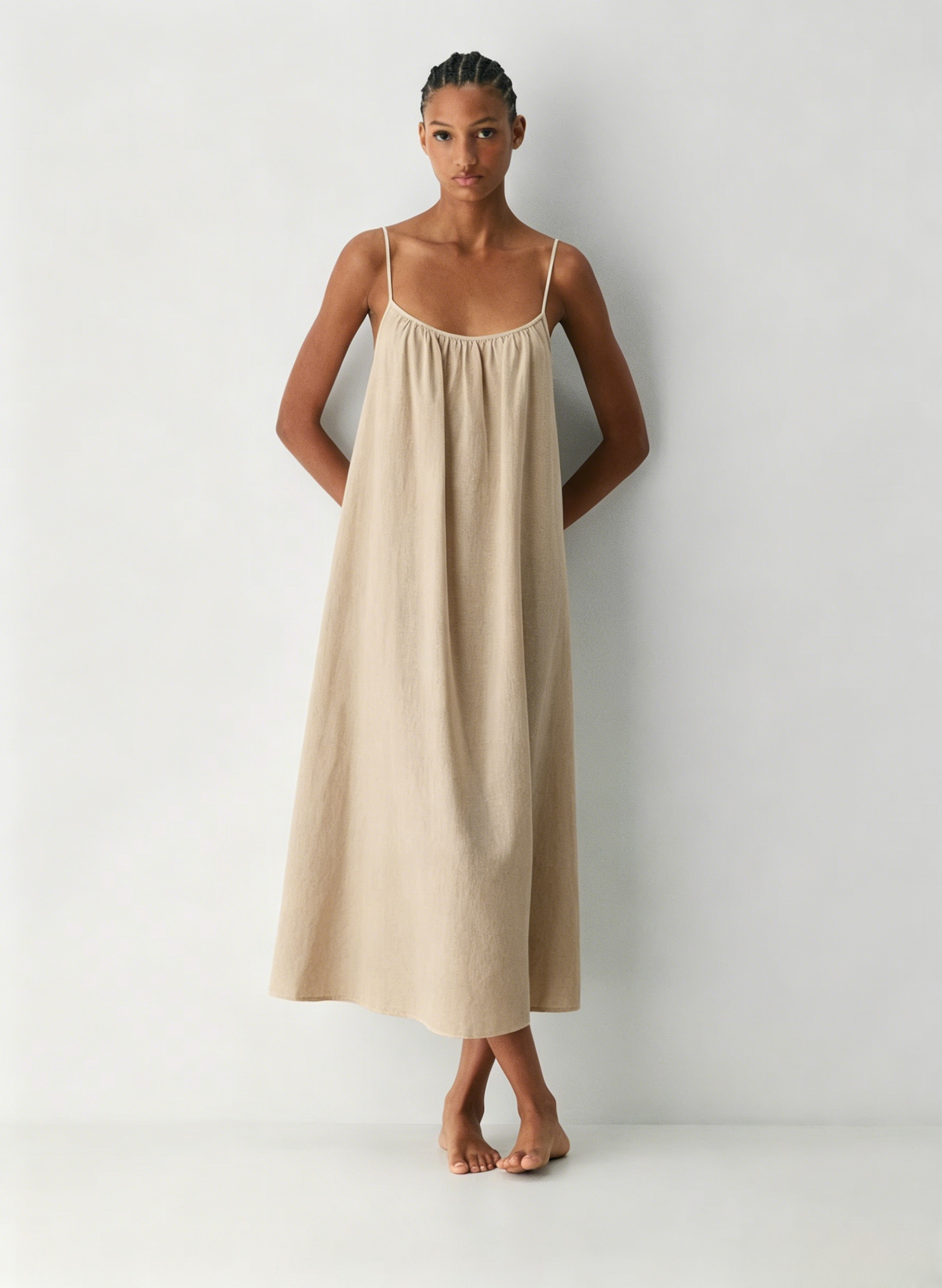 Linen Dress  A long, backless dress with a curved neckline
