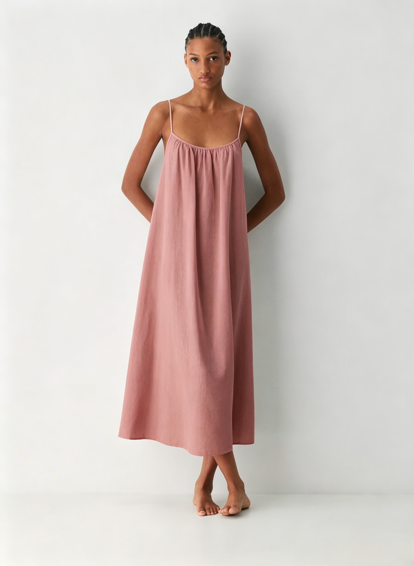 Linen Dress  A long, backless dress with a curved neckline