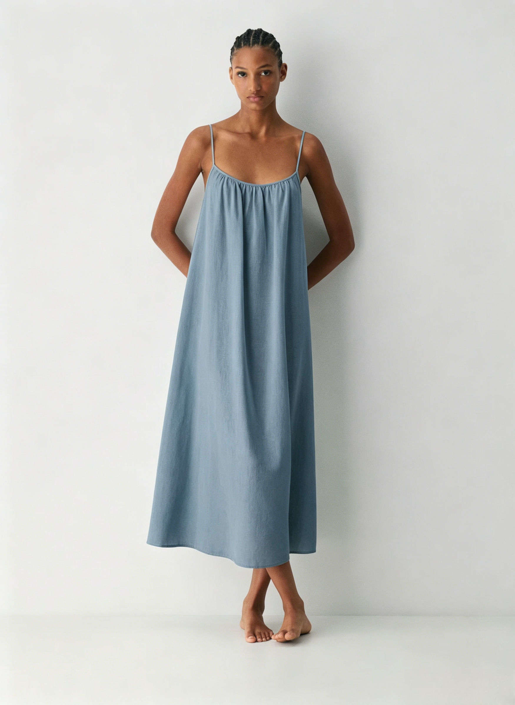 Linen Dress  A long, backless dress with a curved neckline