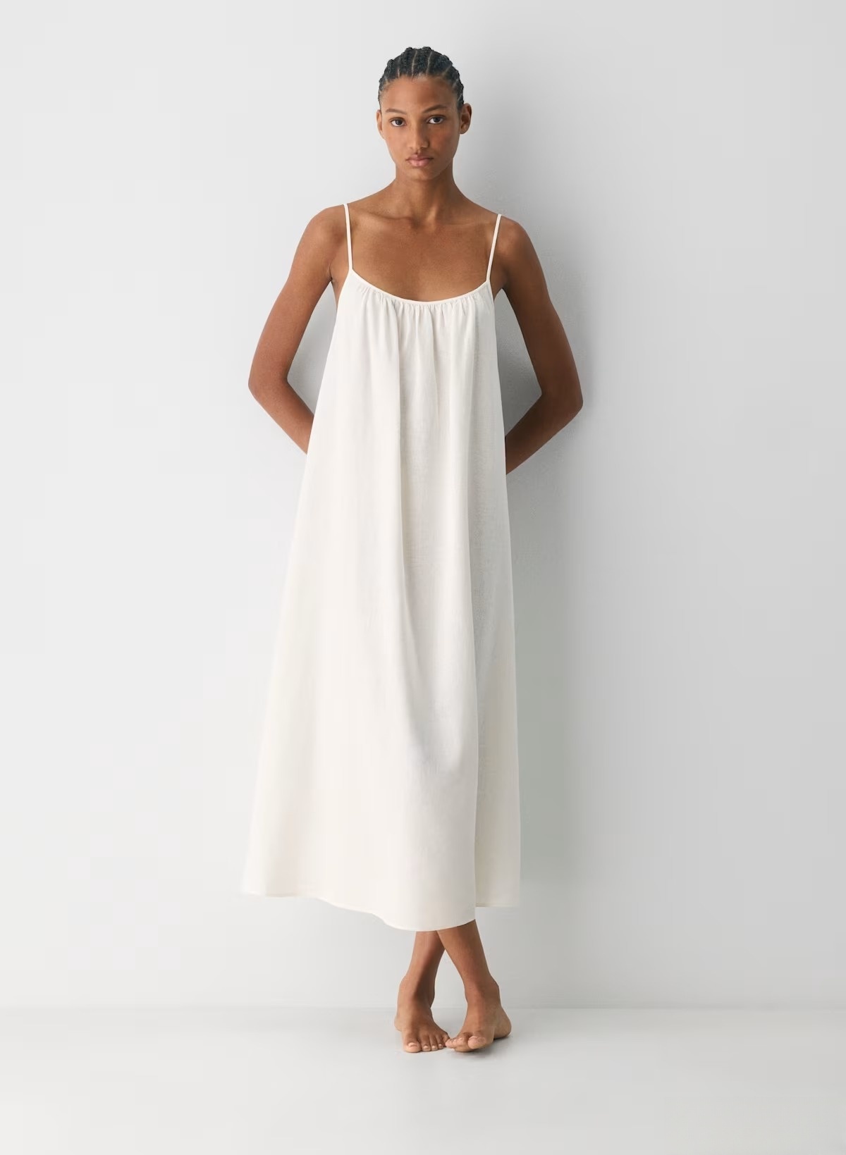 Linen Dress  A long, backless dress with a curved neckline