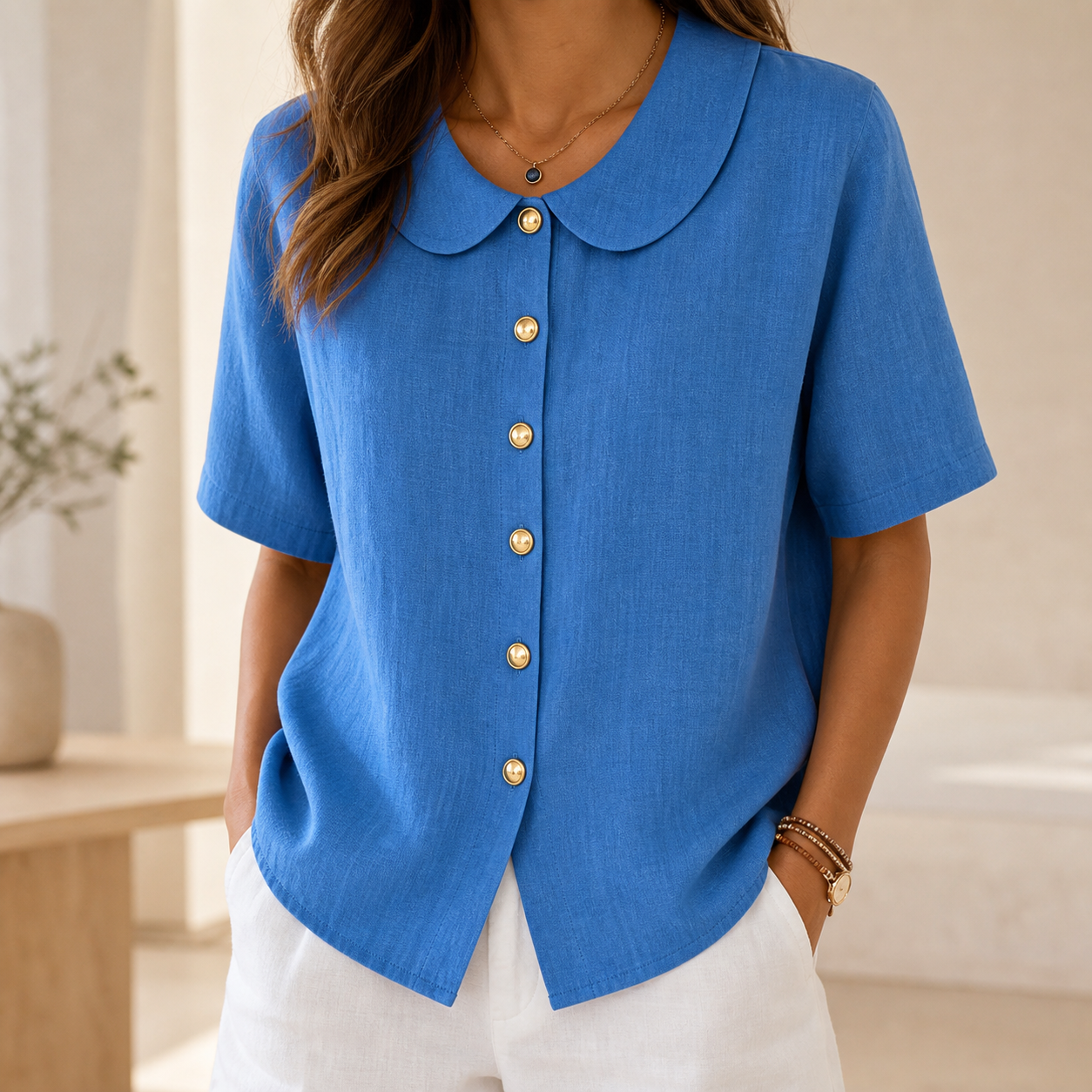 Model wearing linen-look Peter Pan collar blouse