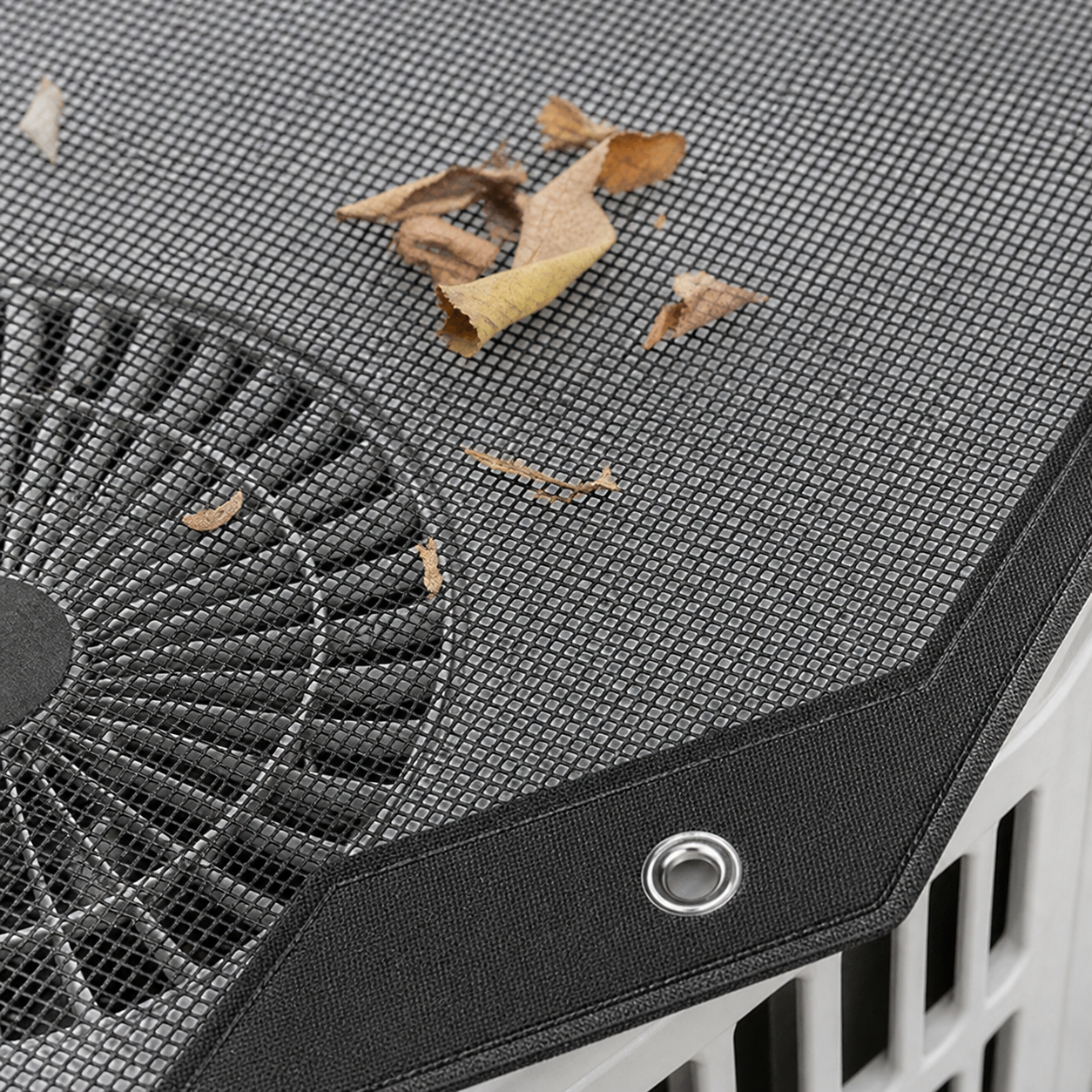 fabric - Open fine mesh allowing airflow while catching larger yard debris