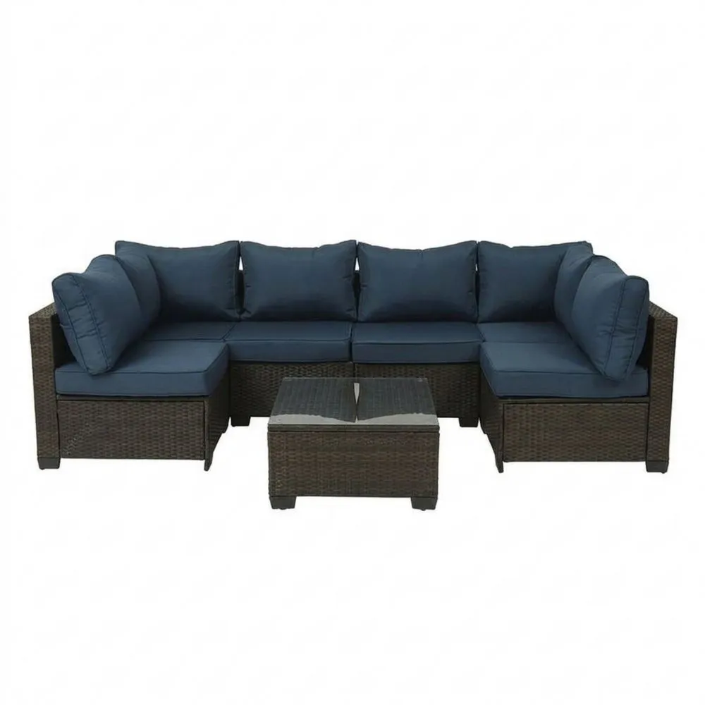 Garten-Loungeset aus Polyrattan mit Ecksofa, blauen Kissen und Glastisch-Retrovillaeu