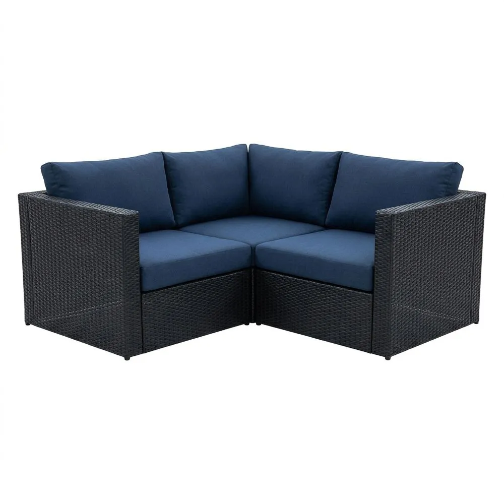 Divano angolare modulare in rattan con cuscini blu