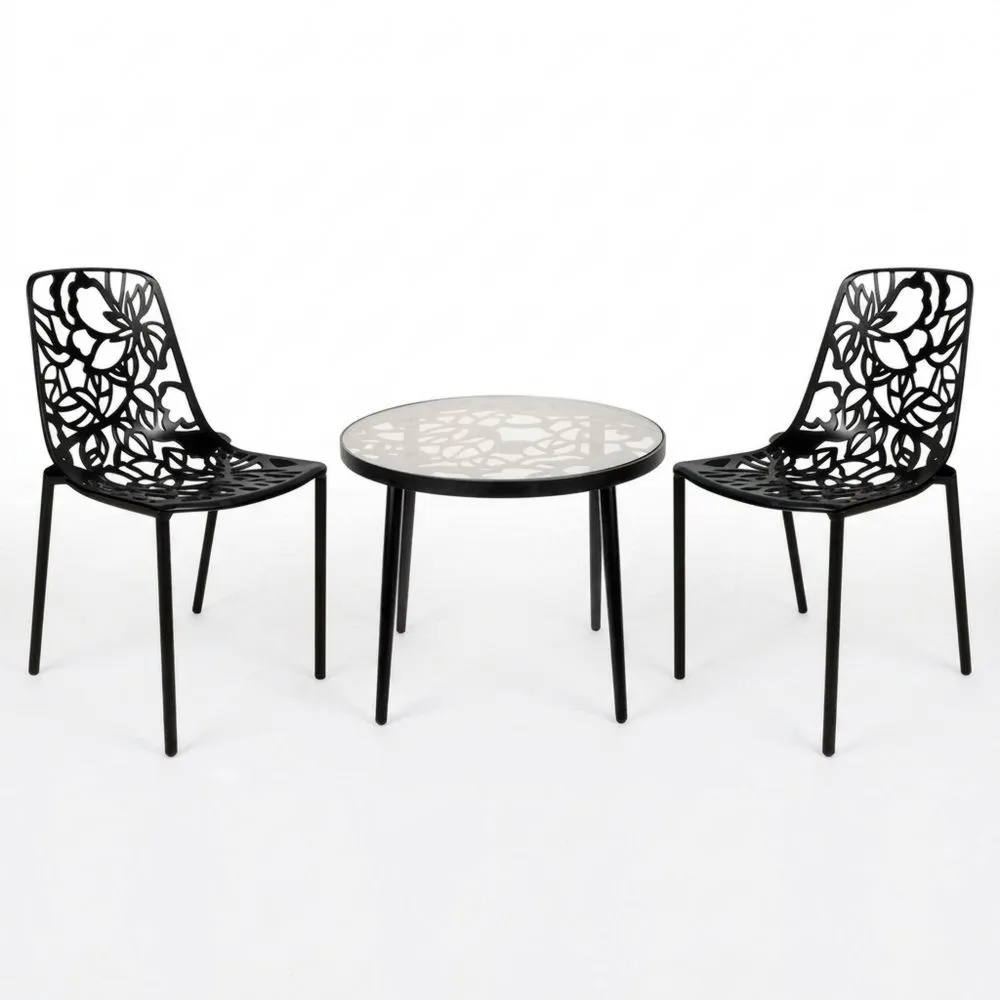Set composto da tavolo e sedie in ferro nero con piano in vetro