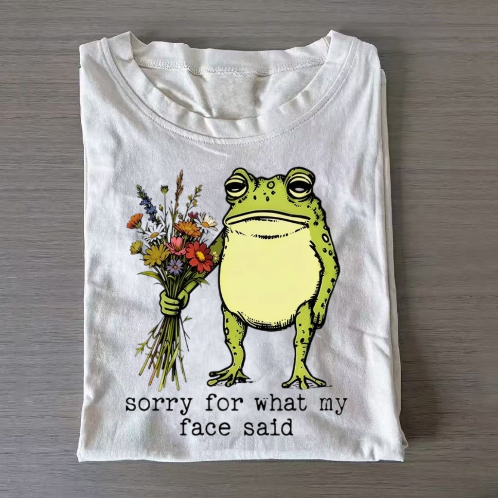 Wildflower Holding Apology Frog Graphic T-Shirt