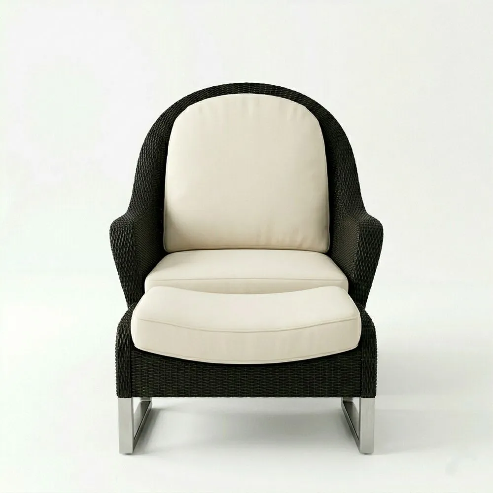 Sillón de ratán sintético con cojines de poliéster y estructura de acero inoxidable