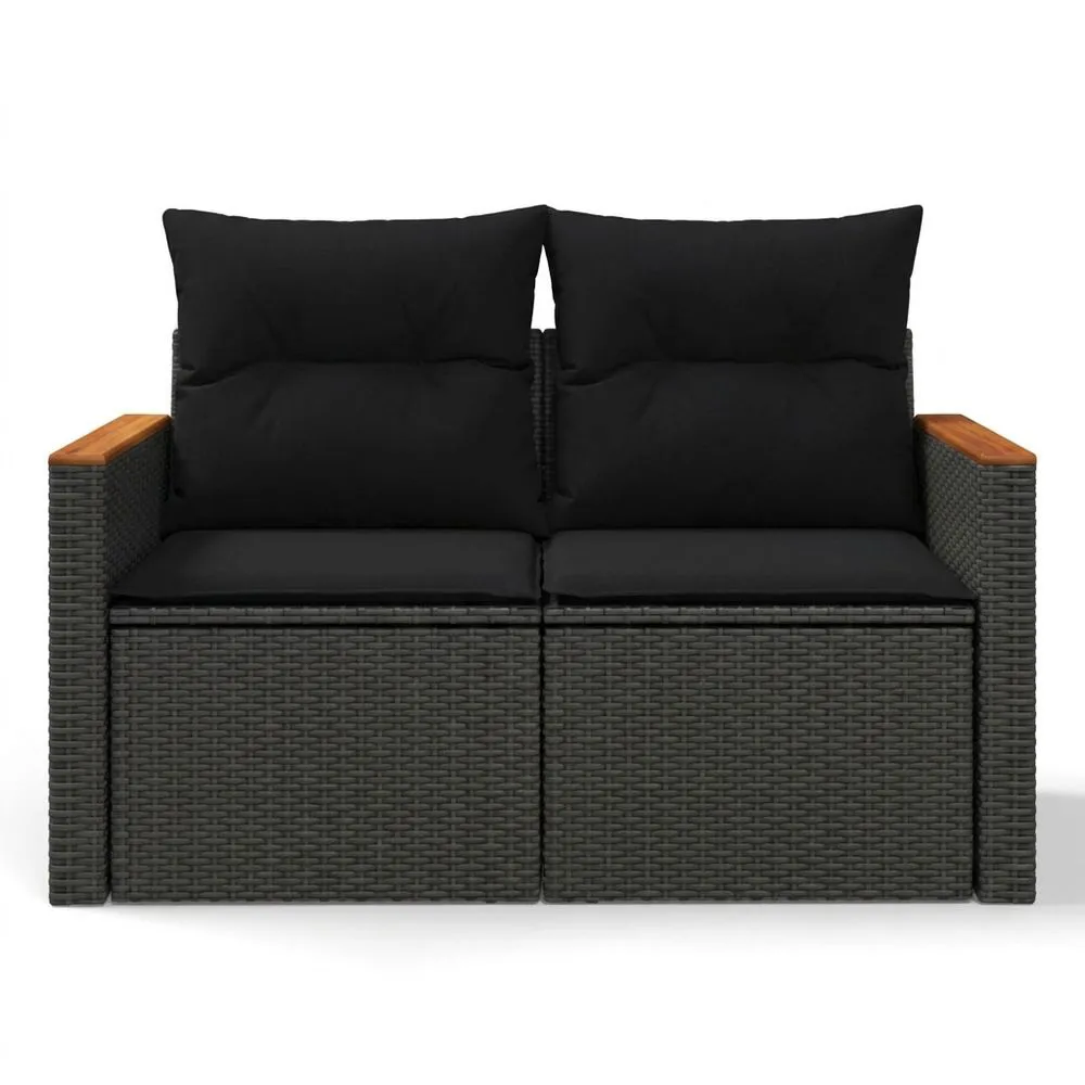 Sofá de ratán sintético con reposabrazos de madera maciza y cojines negros