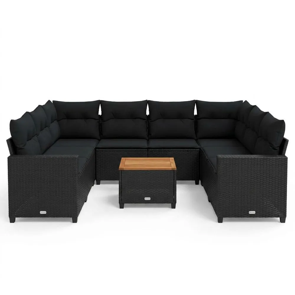 Sofá modular de jardín de imitación de ratán negro y mesa de madera de acacia.