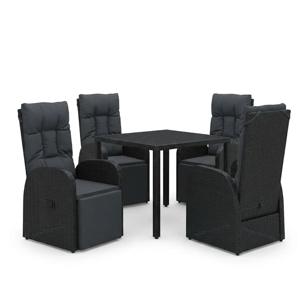 Conjunto de mesa y sillas de ratán sintético negro con cojines.