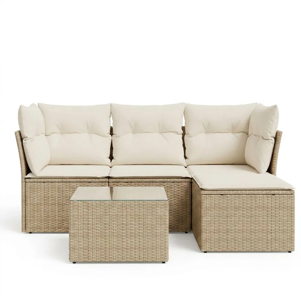 Conjunto de sofá esquinero de ratán sintético color beige, que incluye cojines y mesa de cristal.