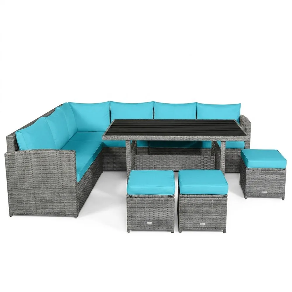 Conjunto de muebles de jardín esquineros de ratán sintético con tapicería azul.