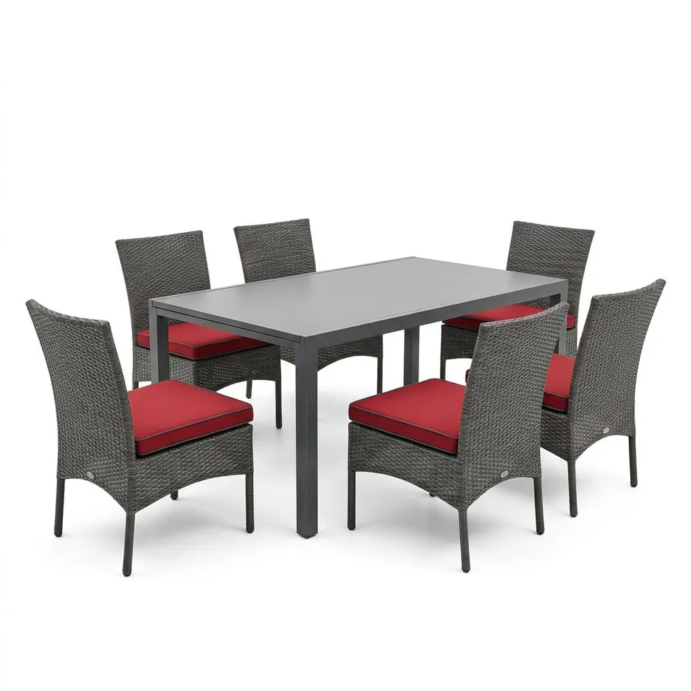 Conjunto de comedor de aluminio con sillas de ratán y cojines rojos