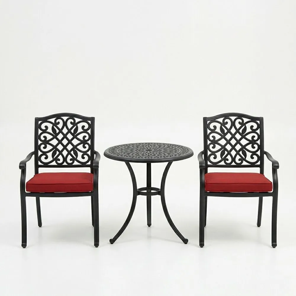 Juego de mesa y sillas de aluminio fundido con cojines rojos
